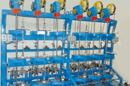 VERTICAL PAPER COVERING MACHINE